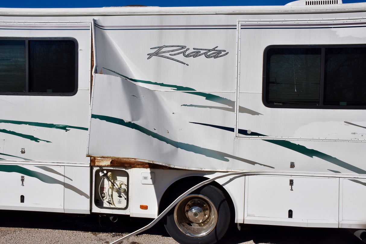 Panel torn from the ide of the RV